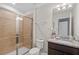 Bathroom featuring granite countertops, tile shower, and modern fixtures at 4582 Terrasonesta Dr, Davenport, FL 33837