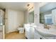 Bright bathroom with tiled shower, dual sinks, and walk-in closet at 8812 Kensington Ct, Kissimmee, FL 34747