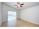 Bedroom with tile flooring, ceiling fan and sliding glass doors leading to the pool area at 8812 Kensington Ct, Kissimmee, FL 34747