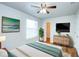 Beautifully decorated bedroom with walk-in closet and mounted TV at 8812 Kensington Ct, Kissimmee, FL 34747