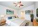 Serene bedroom with a comfortable bed, stylish decor, and soothing color palette promoting relaxation at 8812 Kensington Ct, Kissimmee, FL 34747