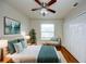 Comfortable bedroom with beautiful decor, hardwood floors, closet, and window at 8812 Kensington Ct, Kissimmee, FL 34747