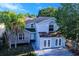 Charming two-story home featuring a stucco exterior and well-manicured landscaping at 8812 Kensington Ct, Kissimmee, FL 34747