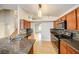 Kitchen boasts granite counters and backsplash, stainless steel appliances and tile floor at 8812 Kensington Ct, Kissimmee, FL 34747
