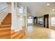 Spacious living room featuring tile flooring, stairs and an open layout at 8812 Kensington Ct, Kissimmee, FL 34747