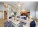 Spacious living area with open layout, vaulted ceilings, and seamless flow to the kitchen and dining areas at 8812 Kensington Ct, Kissimmee, FL 34747