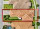 Aerial view of a single-Gathering home featuring a tile roof, driveway, and well-maintained yard at 10254 Beechwood Ln, Orlando, FL 32832
