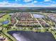 Aerial view of the community featuring multiple ponds and lush green spaces at 10254 Beechwood Ln, Orlando, FL 32832