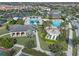 Aerial view of neighborhood amenities, including multiple pools, cabanas, tennis courts, and common areas at 10254 Beechwood Ln, Orlando, FL 32832