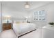Comfortable bedroom with large window, chandelier and neutral color palette providing a bright and calming space at 10254 Beechwood Ln, Orlando, FL 32832