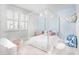 Stylish bedroom with a four-poster bed, complemented by pastel accents creating a relaxing and inviting space at 10254 Beechwood Ln, Orlando, FL 32832