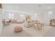 Spacious bonus room with neutral colors, comfortable seating, and ample natural light at 10254 Beechwood Ln, Orlando, FL 32832