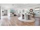 Open concept living and dining area showcasing hardwood floors and lots of natural light at 10254 Beechwood Ln, Orlando, FL 32832