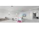 Bright living room offers recessed lighting, a sectional sofa, and large windows at 10254 Beechwood Ln, Orlando, FL 32832