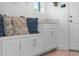 Mudroom featuring custom storage with bench seating, offers practical organization and enhanced functionality to the space at 10254 Beechwood Ln, Orlando, FL 32832