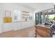 Bright home office with custom built-ins, floating shelves, and a sliding glass door for indoor-outdoor living at 10254 Beechwood Ln, Orlando, FL 32832