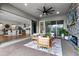 Spacious covered patio with a fireplace and comfortable seating, great for outdoor living and dining at 10254 Beechwood Ln, Orlando, FL 32832
