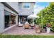 Inviting outdoor patio with comfortable seating and lush landscaping, perfect for relaxing and entertaining at 10254 Beechwood Ln, Orlando, FL 32832