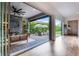 Covered patio featuring stone accent wall, outdoor seating, and backyard at 10254 Beechwood Ln, Orlando, FL 32832