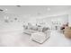 Bright playroom featuring a sectional sofa and multiple large windows at 10254 Beechwood Ln, Orlando, FL 32832