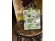 Close up of a table with a book titled 'House Manual Required Reading' and a sign with the WIFI password at 1370 Tuscan Ter # 2201, Davenport, FL 33896