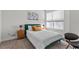Cozy bedroom featuring a comfortable bed, stylish nightstands, and a bright window with natural light at 17407 Hidden Forest Dr, Clermont, FL 34714