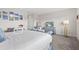 Bright primary bedroom featuring calming colors, closet and a television at 17407 Hidden Forest Dr, Clermont, FL 34714