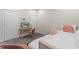 Bright bedroom features a comfy daybed, wooden desk and a television at 17407 Hidden Forest Dr, Clermont, FL 34714