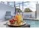 Relaxing hot tub area with drinks and snacks for a luxurious spa experience indoors at 17407 Hidden Forest Dr, Clermont, FL 34714