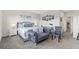 Spacious bedroom with sitting area, king bed, and stylish decor at 17407 Hidden Forest Dr, Clermont, FL 34714
