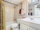 Tiled bathroom featuring a shower and tub combination, a white vanity and an elegant framed mirror at 200 Maitland Ave # 87, Altamonte Springs, FL 32701
