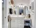 Bright bathroom showcasing a vanity, an expansive mirror, a makeup table, and modern lighting at 200 Maitland Ave # 87, Altamonte Springs, FL 32701