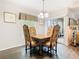 Charming dining area featuring elegant table setting, natural light, and easy access to the living room at 200 Maitland Ave # 87, Altamonte Springs, FL 32701