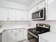 Updated kitchen features stainless steel appliances, white cabinets, and lots of counter space for cooking and entertaining at 200 Maitland Ave # 87, Altamonte Springs, FL 32701