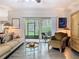 Bright living room with sliding glass doors to patio that bring natural light and an indoor-outdoor feel at 200 Maitland Ave # 87, Altamonte Springs, FL 32701