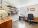 Bright office with a built-in bookcase and modern wooden desk providing a perfect work-from-home atmosphere at 200 Maitland Ave # 87, Altamonte Springs, FL 32701