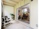 Cozy patio with comfortable seating and view into the house through sliding glass doors at 200 Maitland Ave # 87, Altamonte Springs, FL 32701