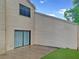The home's exterior features a covered patio and manicured lawn at 2832 Risser Ave, Orlando, FL 32812