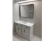 Bathroom vanity with quartz counters, modern hardware, and recessed lighting at 2832 Risser Ave, Orlando, FL 32812