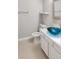 Charming bathroom featuring a unique glass vessel sink, white countertops, and modern fixtures at 2832 Risser Ave, Orlando, FL 32812