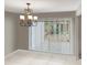 A formal dining room is brightened by backyard light entering through sliding glass doors at 2832 Risser Ave, Orlando, FL 32812