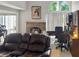A cozy living room offers a fireplace and ample lighting at 2832 Risser Ave, Orlando, FL 32812