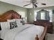 The main bedroom boasts a large bed and dark wood furniture at 2832 Risser Ave, Orlando, FL 32812