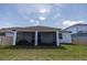 Screened back porch and back yard at 4012 Meandering Bay Dr, Apopka, FL 32712