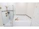 Modern bathroom featuring a soaking tub, updated shower with glass door, and gold fixtures at 4012 Meandering Bay Dr, Apopka, FL 32712