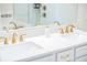 Bright bathroom featuring a double vanity, white quartz countertops and gold fixtures at 4012 Meandering Bay Dr, Apopka, FL 32712