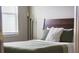 Bedroom featuring a soft green comforter and a large sunny window at 4012 Meandering Bay Dr, Apopka, FL 32712