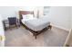 Clean bedroom featuring a desk, plush carpet, and a wooden bed frame at 4012 Meandering Bay Dr, Apopka, FL 32712