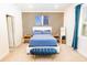 This bedroom features a modern accent wall, plush carpet, and stylish blue furniture that creates a relaxing retreat at 4012 Meandering Bay Dr, Apopka, FL 32712