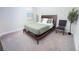 Comfortable bedroom features neutral carpeting, natural light, and stylish contemporary decor at 4012 Meandering Bay Dr, Apopka, FL 32712